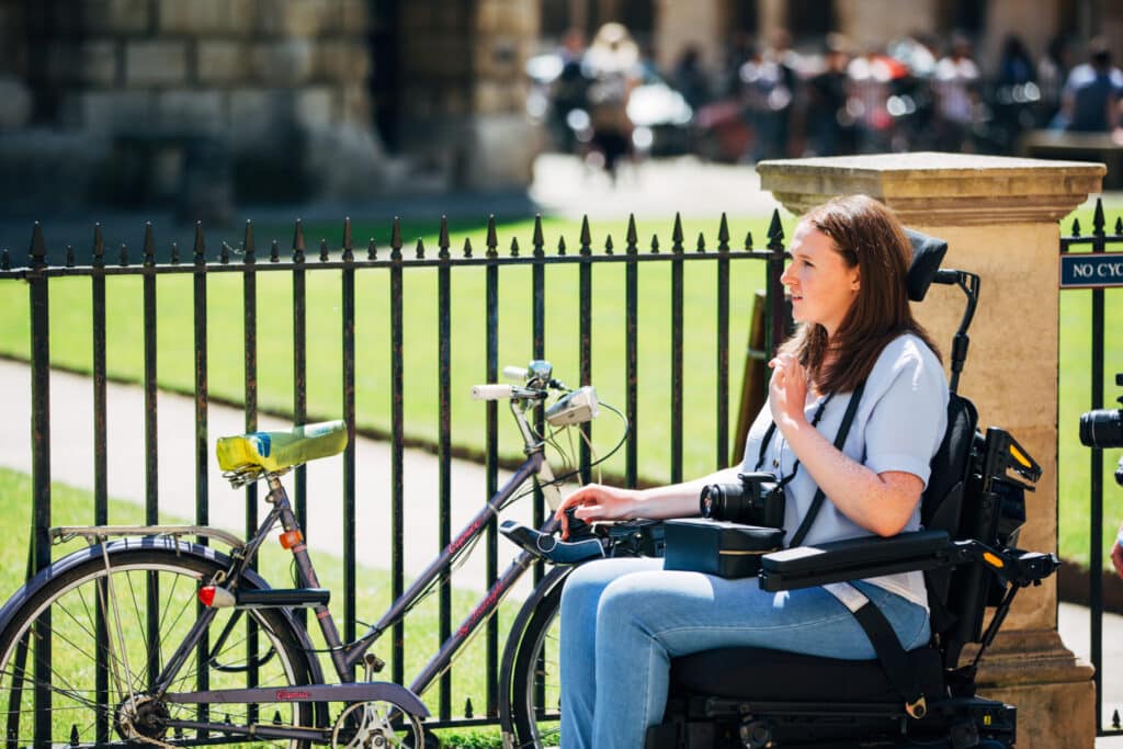 Woman on mobility scooter in a town